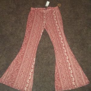 Rust orange stretch pants.